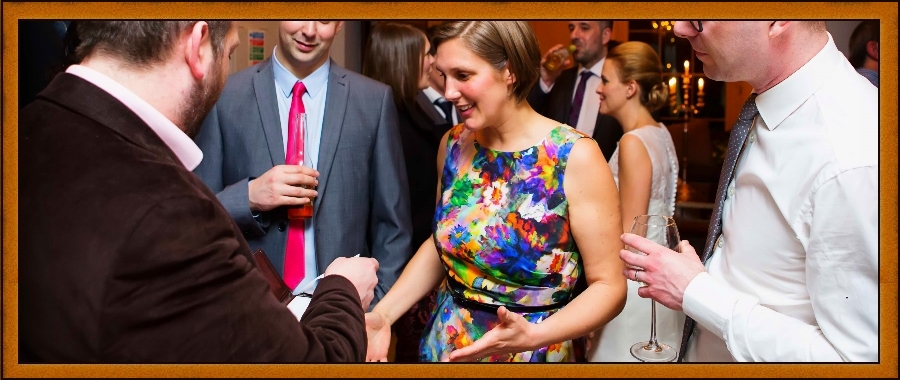 Nottingham Magician Atlas Brookings works tables at a corporate event